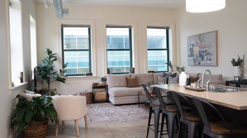 a living room and dining room with a table and chairs at Market Square Place, Pennsylvania